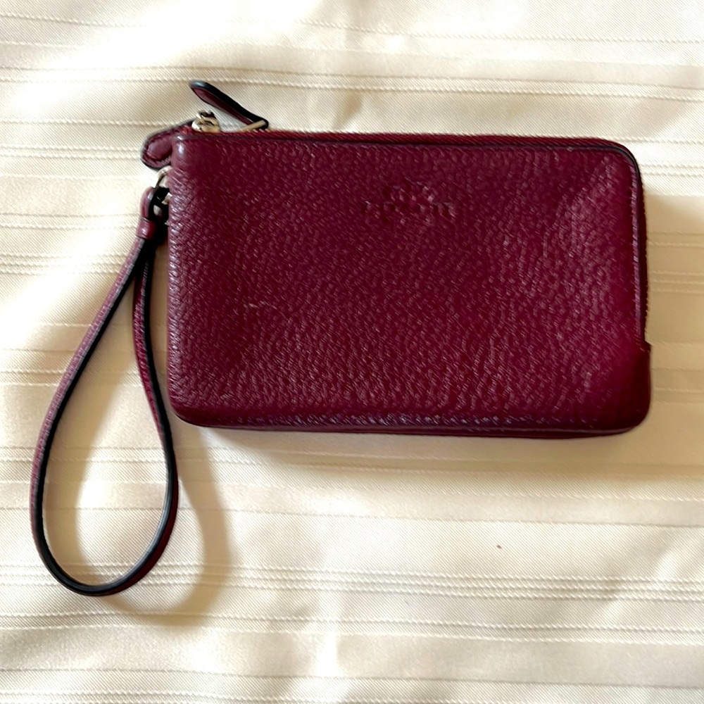 A woman’s wallet by Coach.  Great for Mother’s Day gift